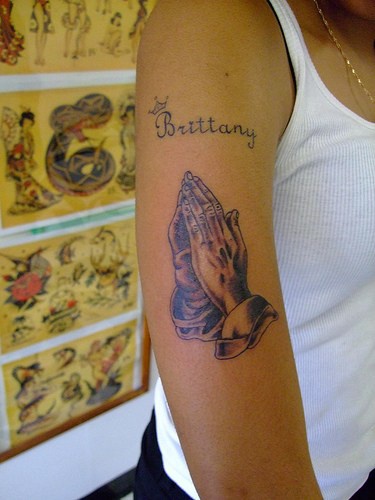 Praying hands black ink tattoo