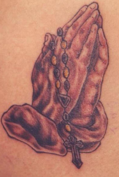 Classic praying hands with rosary tattoo