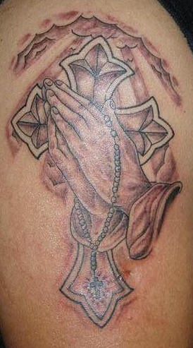 Praying hands and cross tattoo