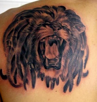 Rasta lion with dreadlocks tattoo