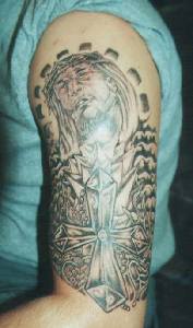 Christian themed tattoo on arm