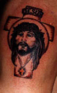 Cross and jesus portrait tattoo