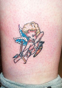 Colourful cherub with bow tattoo