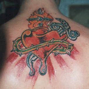 Red sacred heart tattoo