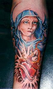 Woman in blue cloak and heart tattoo