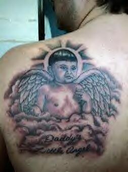 Winged baby on clouds tattoo