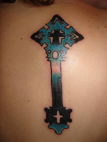 Blue cross with tracery tattoo