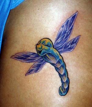 Surreal colourful insect tattoo