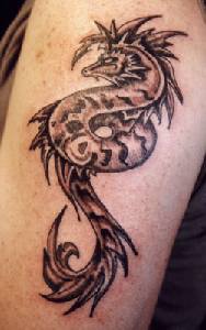 Surreal sea horse serpent tattoo