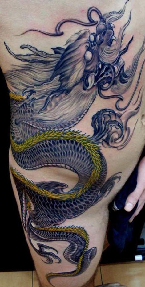 Rib and side tattoo, big monster dragon, flying in the sky
