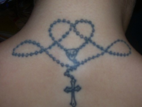 Rosary tracery tattoo on neck