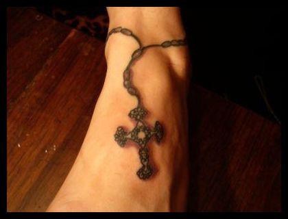 Realistic rosary armband tattoo