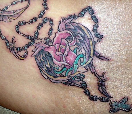 Rosary and flower with wings tattoo
