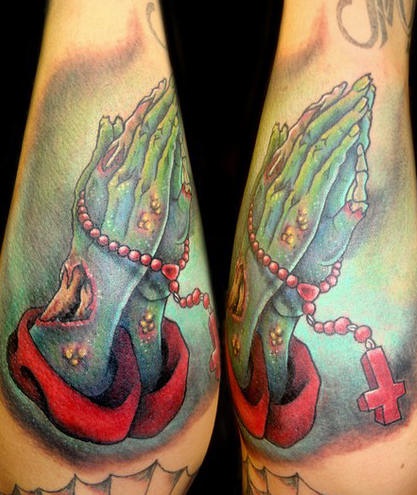 Rosary and zombie praying hands tattoo