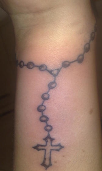 Rosary bead wrist tattoo