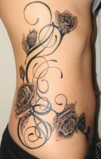 Big vine tattoo of roses on the side