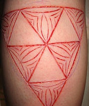 Skin scarification triforce with tracery
