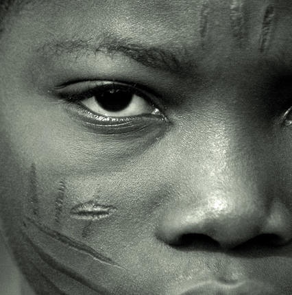 Traditional  scarification marks on face