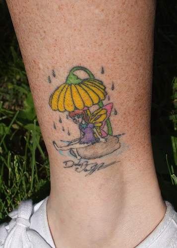 Small fairy under yellow flower on leg