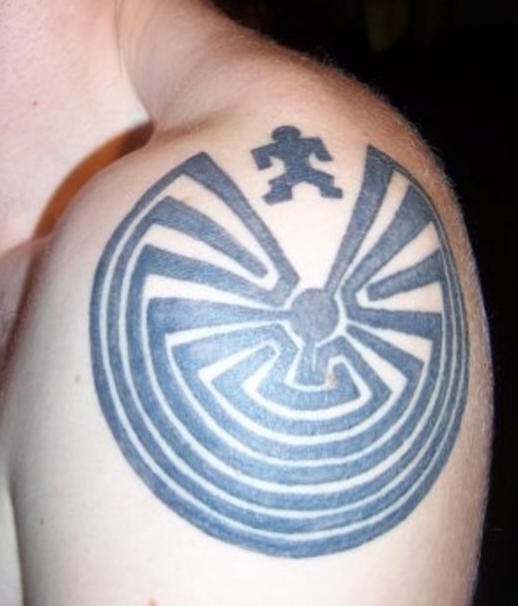 Shoulder tattoo, man near big labyrinth