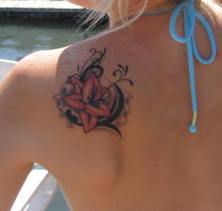 Shoulder tattoo, little, bright ,red poppy, decorated