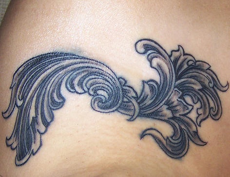 Shoulder tattoo, image of many curles