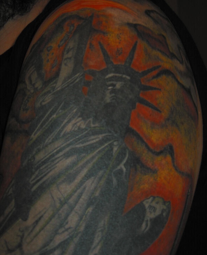 Shoulder tattoo,dark, styled  statue of liberty