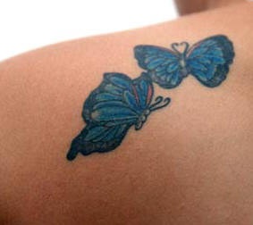 Shoulder tattoo, two handsome, blue butterflies