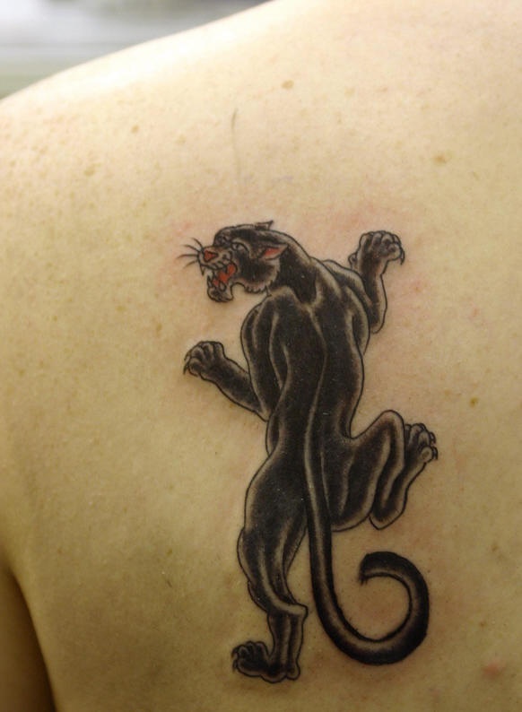 Shoulder tattoo, black panther growling