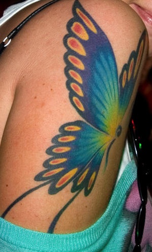 Shoulder tattoo, big, picturesque, flying butterfly
