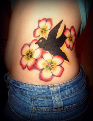 Side tattoo, black, contrast swallow flying near flowers