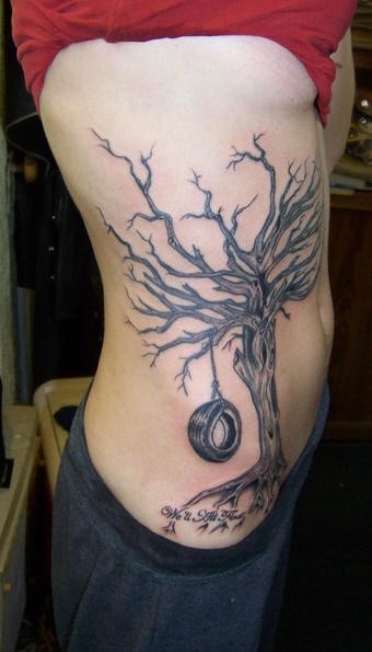 Side tattoo, big, black tree, hanging wheel