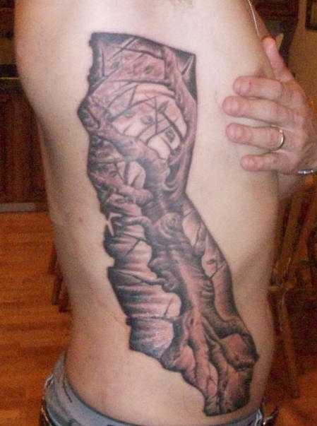 Side tattoo, fragment of thickset strong tree