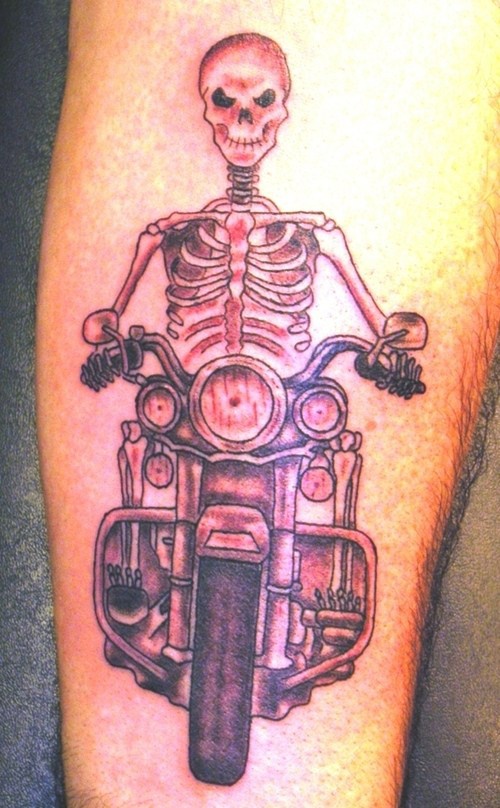 Skeleton on motorcycle tattoo