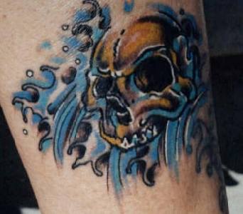 Skull in sea waves tattoo