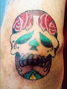 Sugar skull with roses tattoo
