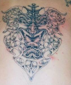 Demon tracery with skull tattoo