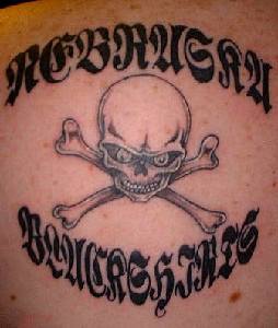 Skull and crossbones with writings  tattoo