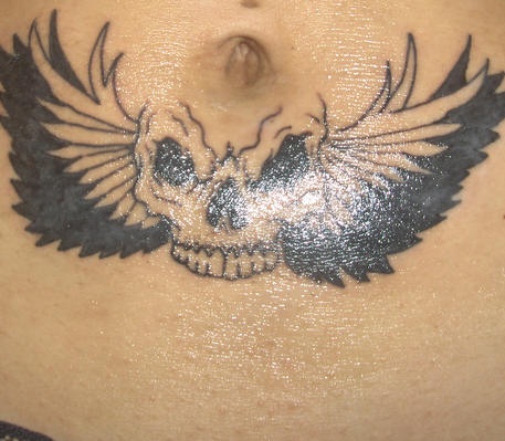 Stomach tattoo,black  skull belly button