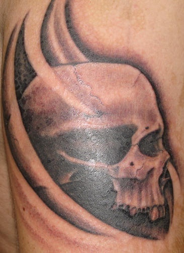 Human skull side view tattoo