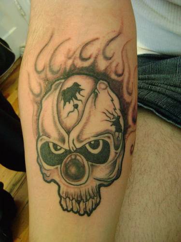 Black flaming skull tattoo