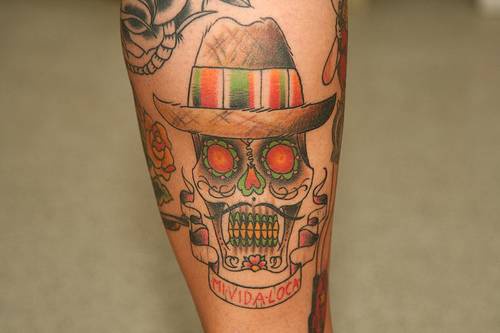 Mexican sugar skull in hat tattoo