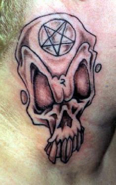 Skull with pentagram on forehead tattoo
