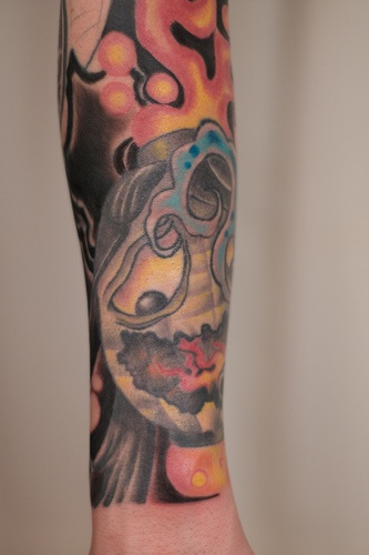Colourful smile sleeve tattoo