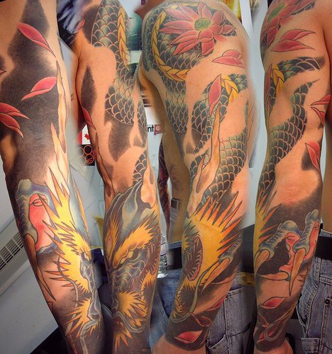 Old wise asian dragon sleeve tattoo