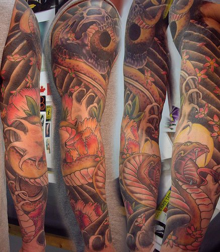Colourful asian snake sleeve tattoo