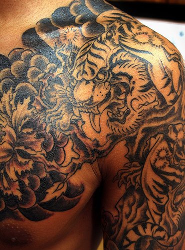 Tiger black ink sleeve tattoo