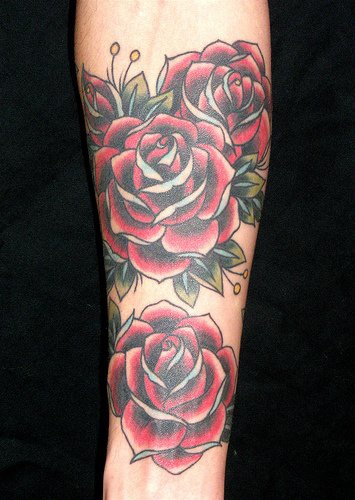 Lush red rose sleeve tattoo