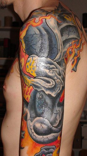 Black dragon sleeve tattoo