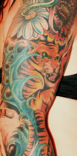 Asian tiger in flowers sleeve tattoo